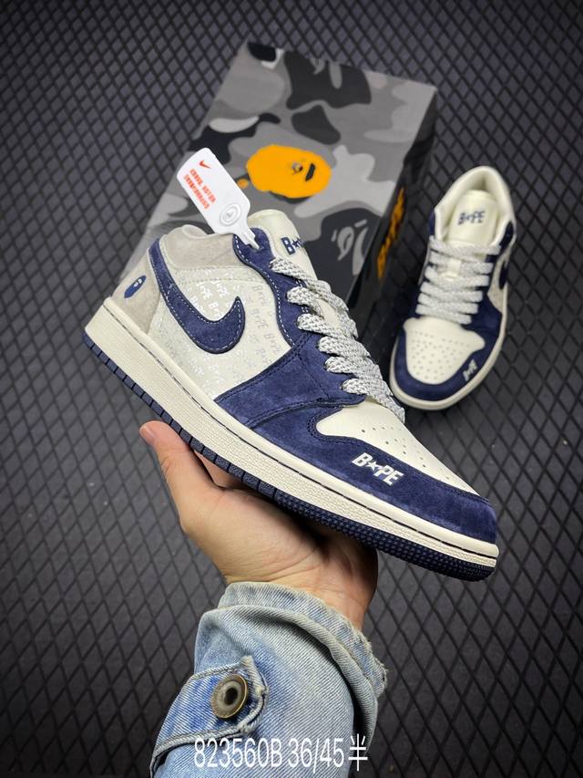 公司级bape X Air Jordan 1 Low 蓝灰猪八 此款主张打破传统的工业化流水线设计限制，以made By Ideas的超级创意为理念，集结众多潮