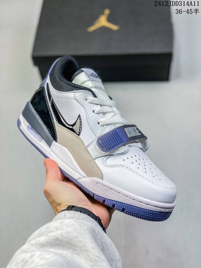 真标带半码air Jordan Legacy Aj312 低帮 鞋身采用了皮革材质打造 横跨鞋面的魔术贴十分吸睛 侧面的swoosh Logo的一部分被鞋面遮挡