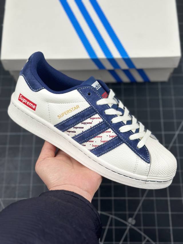 阿迪达斯 Adidas Superstar X Supreme 联名 三叶草经典贝壳头系列 新款休闲板鞋潮流男女士运动鞋 鞋面柔软皮革材质 标志性的贝壳鞋头，锯