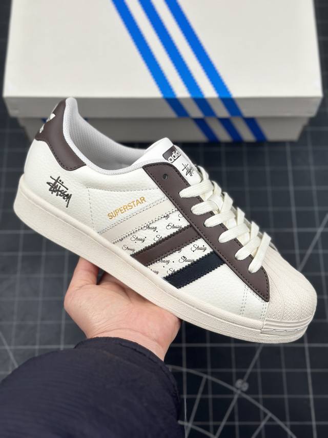 阿迪达斯 Adidas Superstar X 斯图西联名 三叶草经典贝壳头系列 新款休闲板鞋潮流男女士运动鞋 鞋面柔软皮革材质 标志性的贝壳鞋头，锯齿三条纹，